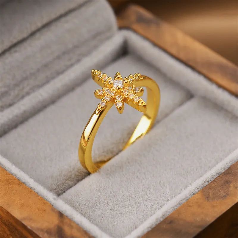 Gold geometric open copper ring with electroplated finish, adjustable for different finger sizes.