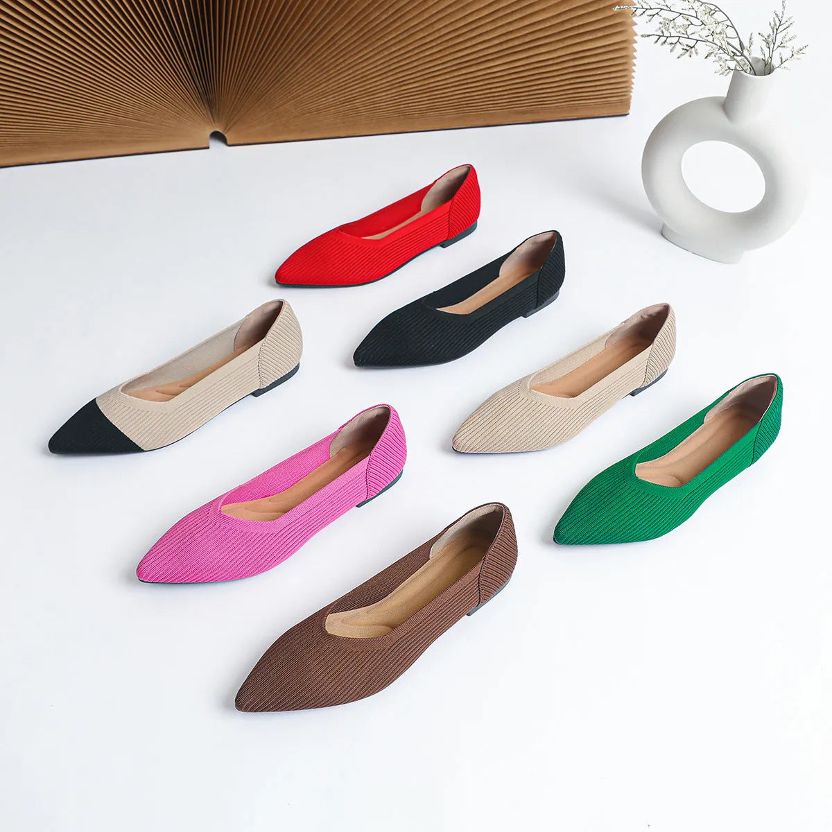 Women's apricot knit flat pump with pointed toe and rubber sole on a white background.