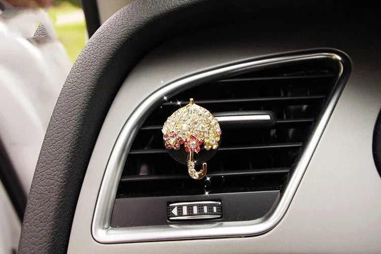 Alloy car perfume clip with liquid fruity scent attached to air vent in various cartoon styles