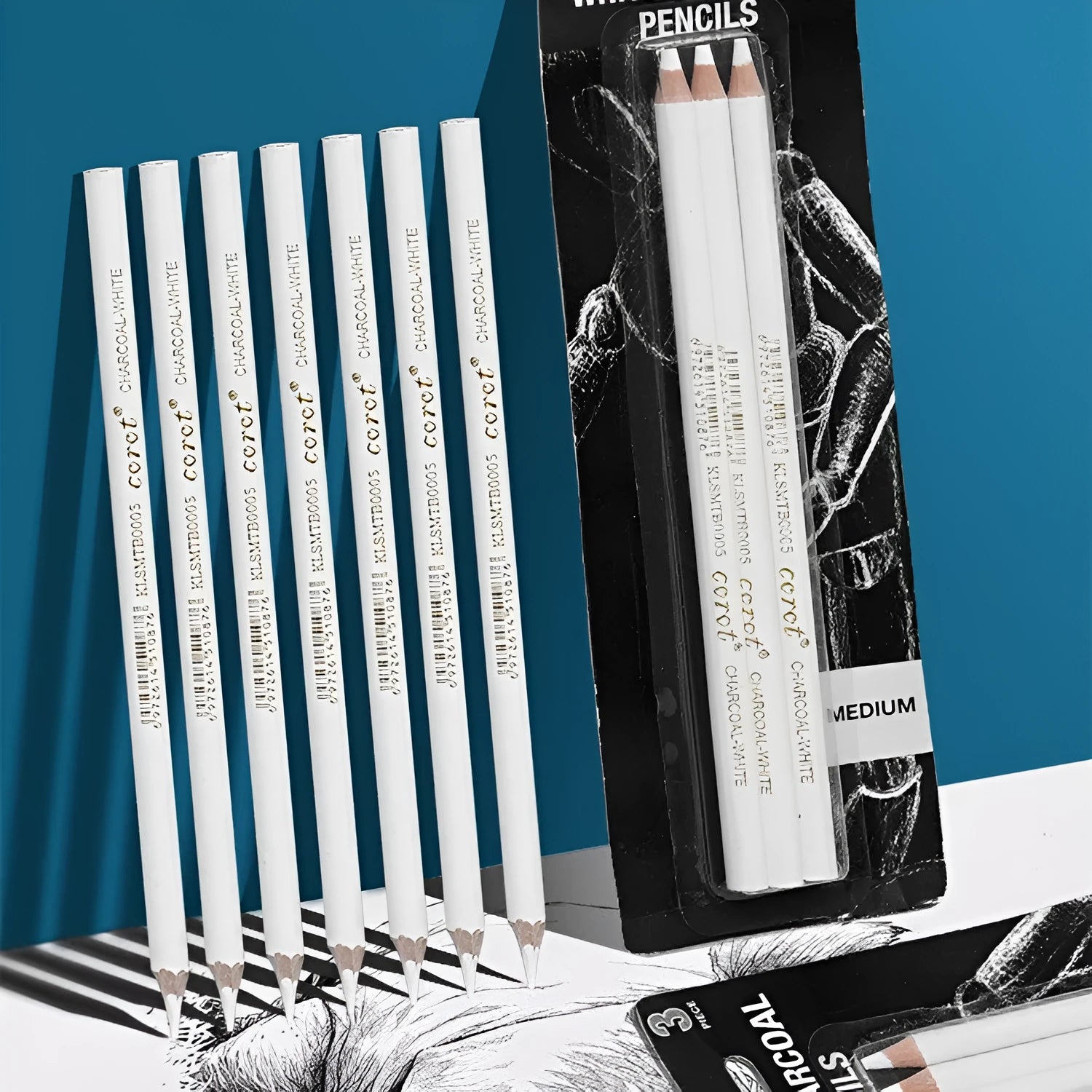 Three white charcoal pencils for sketching on dark paper with highlighting effect
