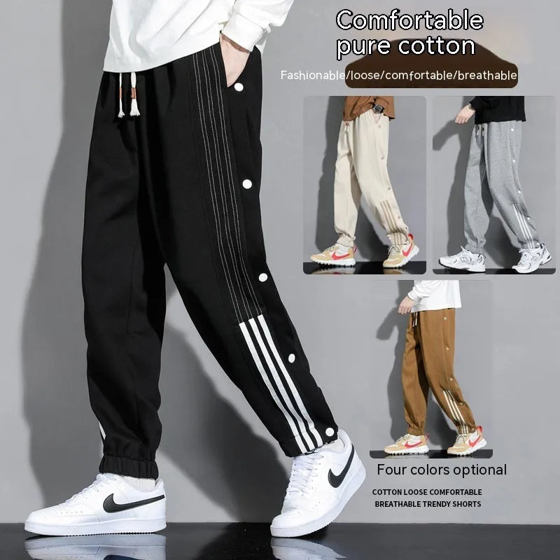 Men's black sports sweatpants with high waist, drawstring closure and ankle ties in cotton blend fabric