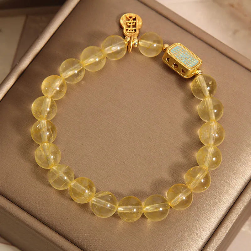 Women's yellow citrine crystal bracelet with rhinestone detailing and adjustable closure