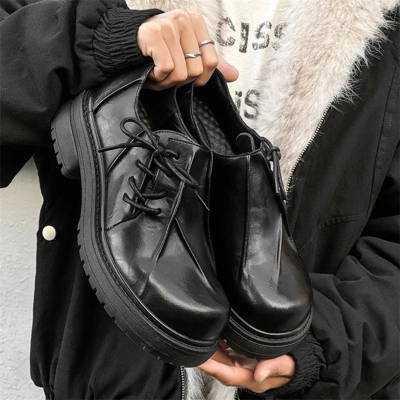 Black platform leather shoes with warped head design and round toe cap