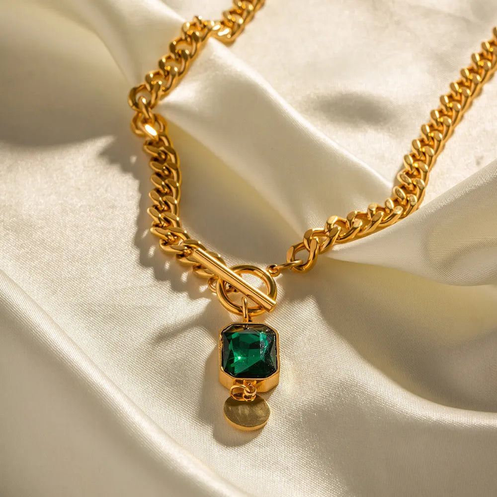 Gold geometric round pendant necklace on Cuban link chain with French retro styling