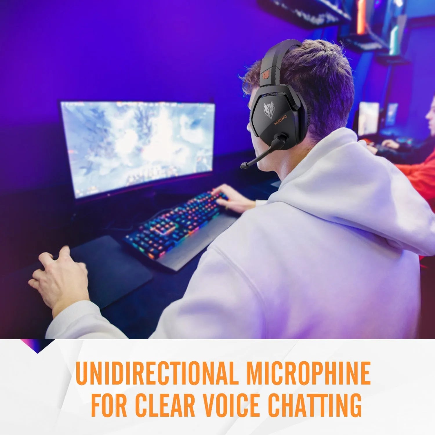 Black and orange wireless gaming headset with over-ear cups and a built-in microphone on a grey background.