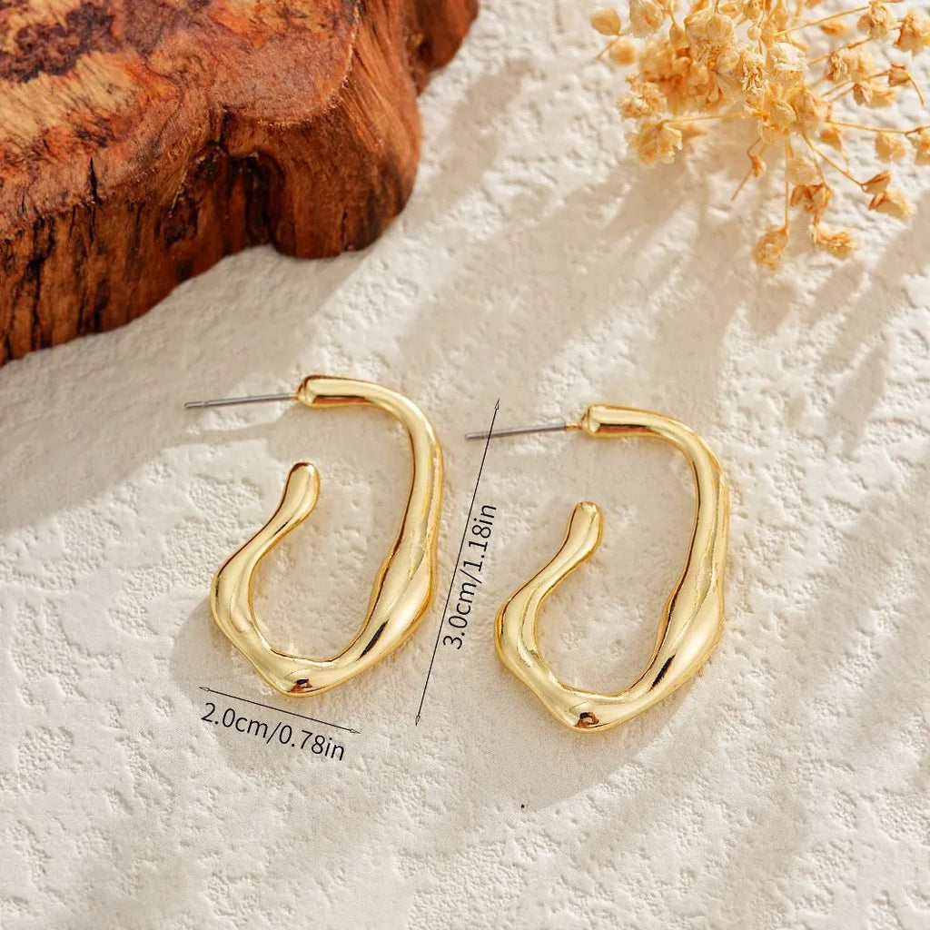 Gold irregular shaped minimalist dangle drop earrings for women with abstract geometric outline
