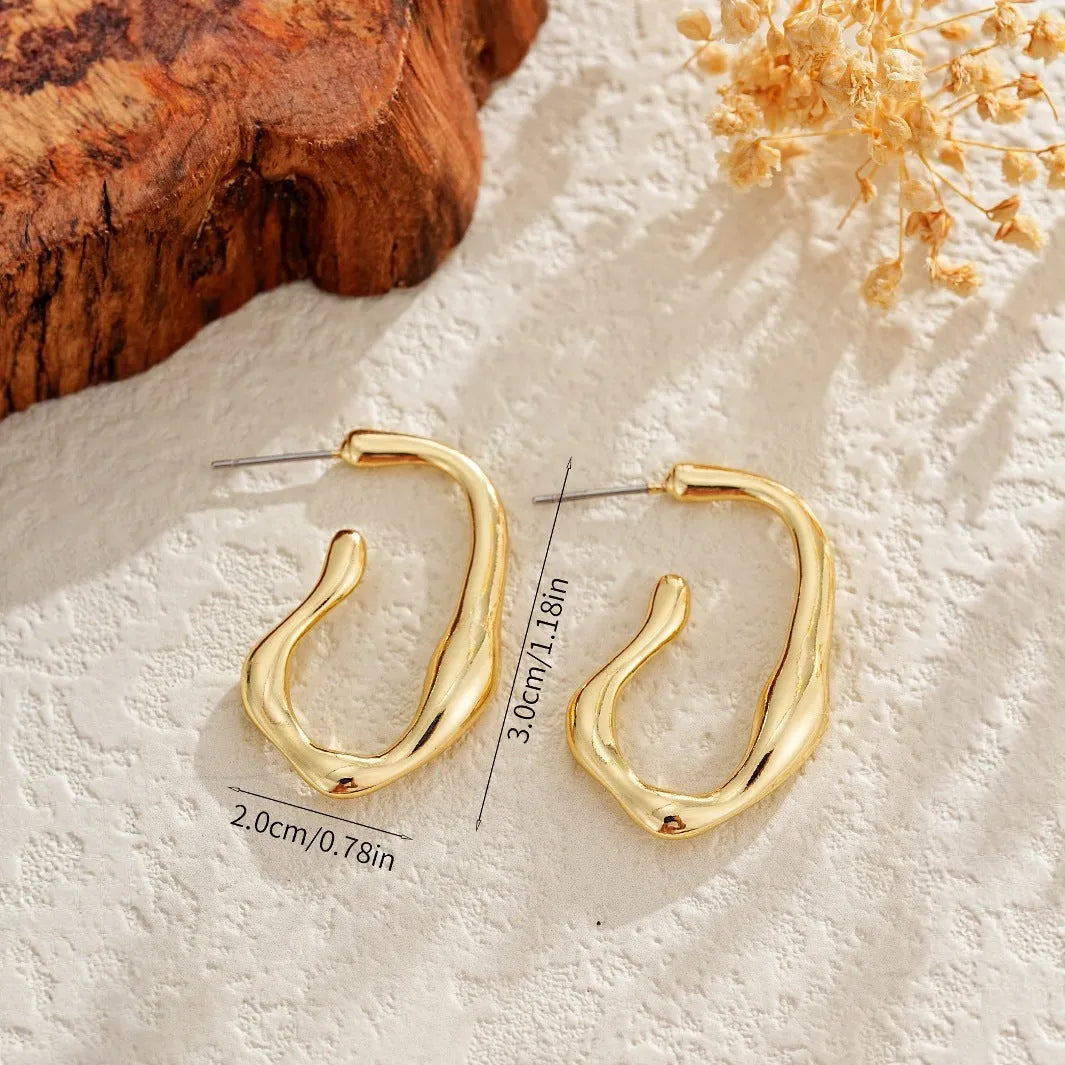Gold irregular shaped minimalist dangle drop earrings for women with abstract geometric outline