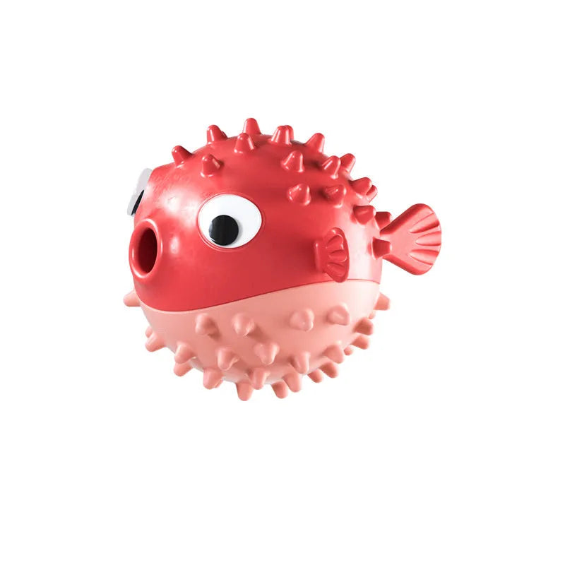 Green fish-shaped interactive dog toy with treat dispensing opening and textured surface for medium and large dogs