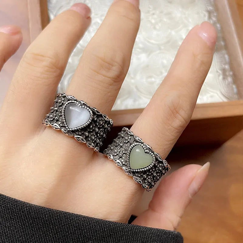Adjustable opening love heart ring in white or green colour with retro wide-faced design