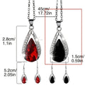 Black and red teardrop glass pendant necklace and matching earrings set made from alloy metal.