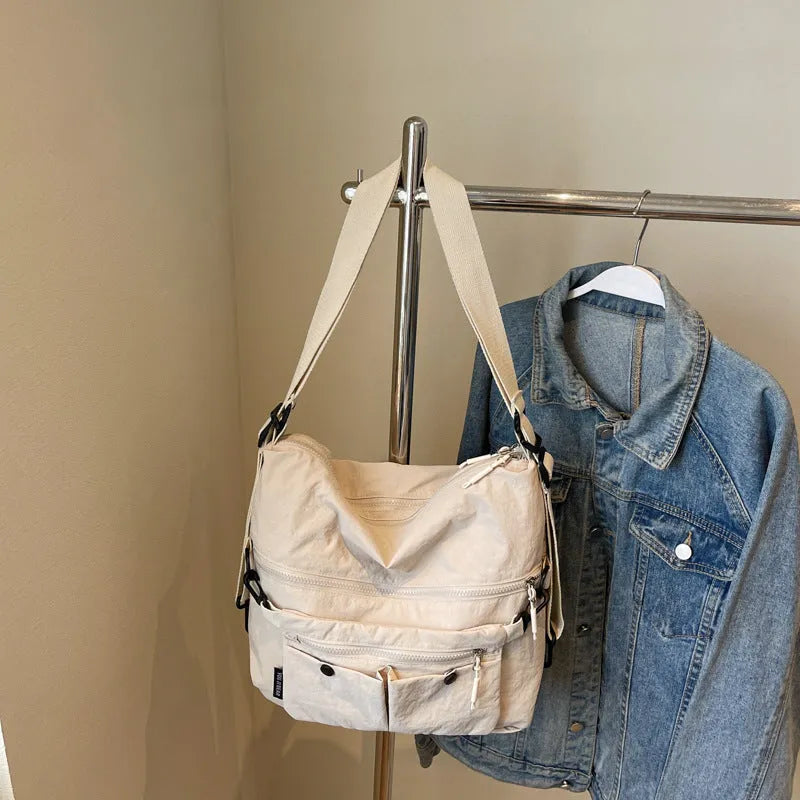 Women's nylon crossbody bag with adjustable strap and external pocket in khaki colour