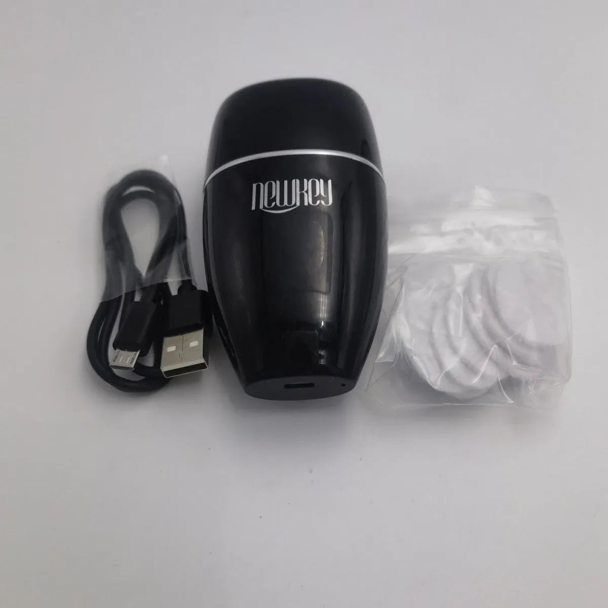 Black electric silicone lip plumper with 3-speed adjustment buttons and USB charging port
