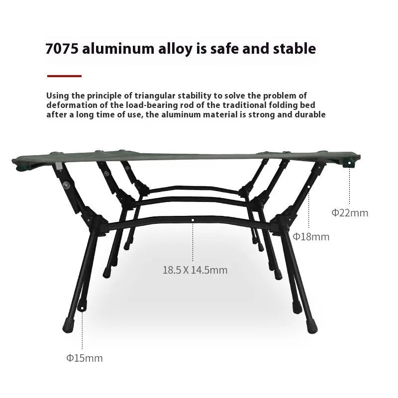 Lightweight portable folding bed set up outdoors in khaki colour with metal frame.