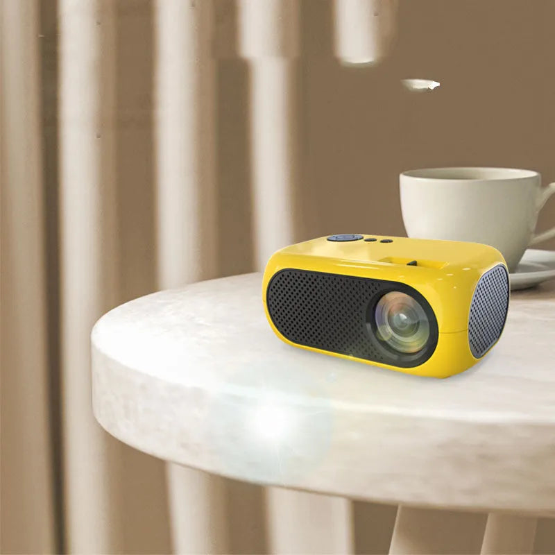 M24 Micro Mini Portable LED Projector in gold and white colours with compact dimensions
