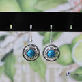 Miao silver retro turquoise flower disk earrings with geometric design in red, blue, and black colours