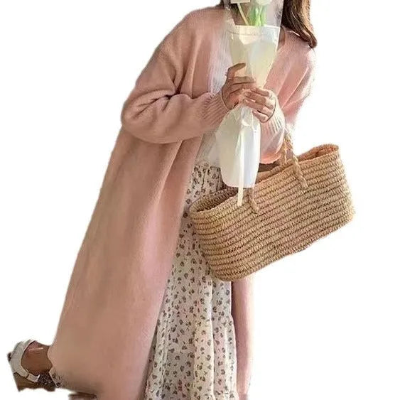 Women's loose fit grey knitted cardigan with V-neck and long sleeves, mid-length style.