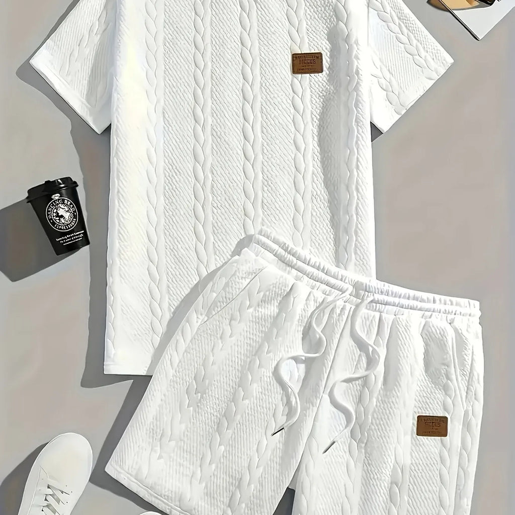 Men's black ribbed two-piece sports set with patch design on short sleeve top and matching shorts