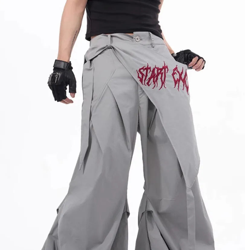 Boy modelling black wide-leg summer trousers with a relaxed fit and Korean-inspired style.