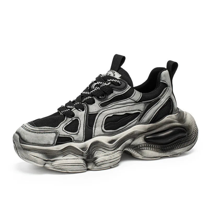 Men's low-top mesh sneakers in grey with a platform sole and lace-up front, on a white background.