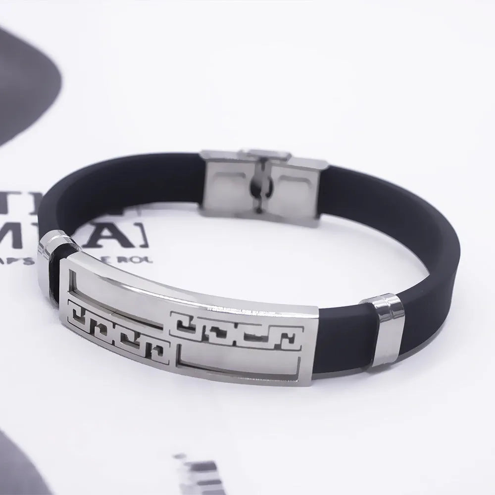 Men's quartz wrist watch set with round alloy dial, black face, and stainless steel buckle on a plain background