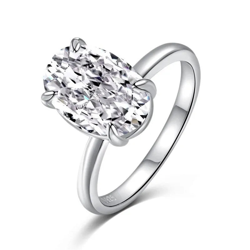 Oval cut solitaire ring in sterling silver with four-claw setting.