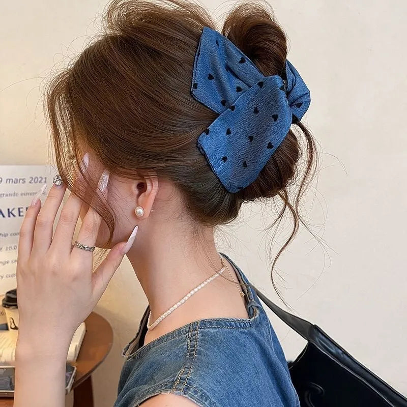 Women's triangle hair grip with denim fabric bow decoration on plastic hairpin