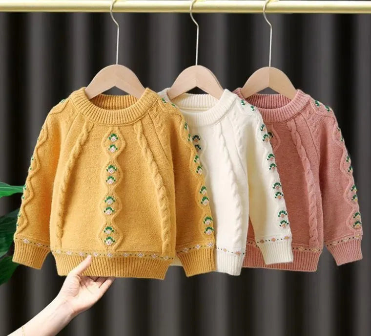 Girls pink knitted diamond flower pullover sweater with rabbit fur composition on white background