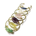 Natural rough stone crystal bracelet with gold winding in a geometric bohemian style.