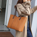 Women's genuine leather crossbody bag with horizontal square design and multiple interior compartments in black colour