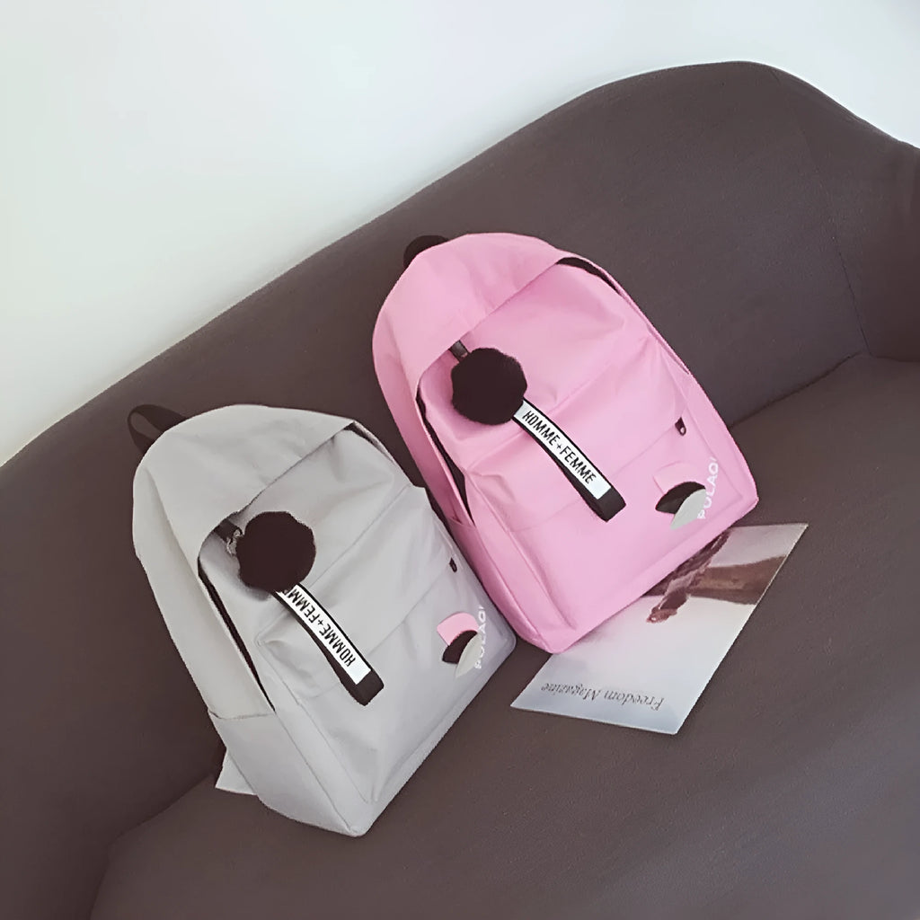 Green canvas college style schoolbag with structured design showing 40cm height and front compartment