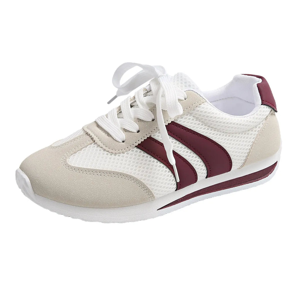 Wine red Cortez Retro sneaker with mesh upper, cross strap, and flat rubber sole.