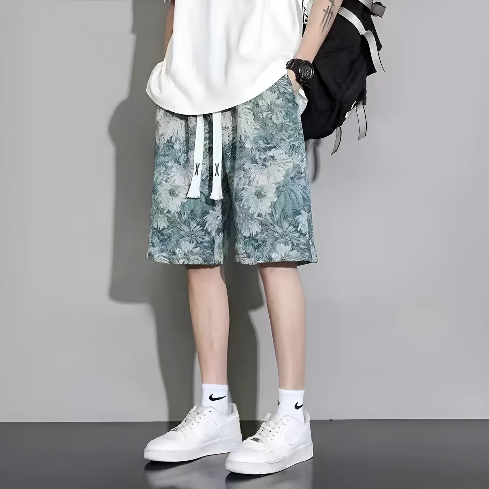 Men's summer fashion shorts in polyester with fifth pants length design showing colour options