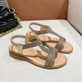 Women's patent leather beach sandals with rhinestone accents in black, gold, and silver colours