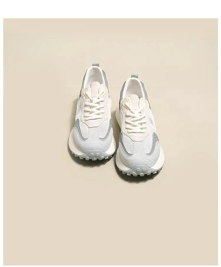 Women's grey and pink low-top retro sneaker with round toe and flat rubber sole