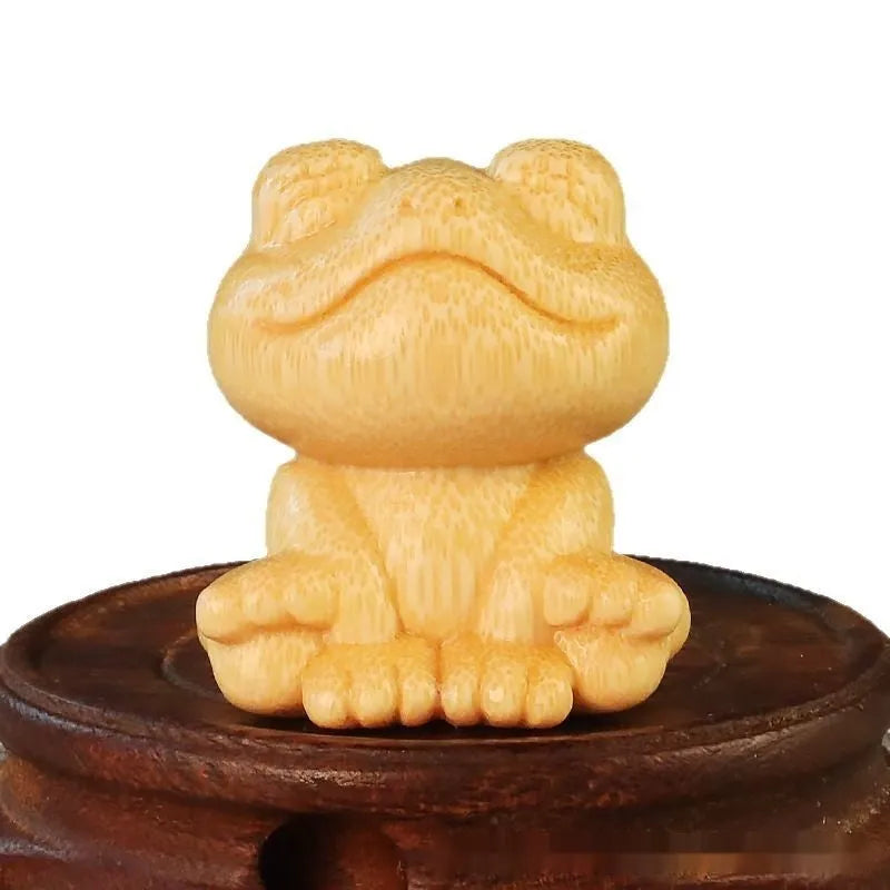 Solid bamboo carving ornament with smiling frog design measuring 5cm height