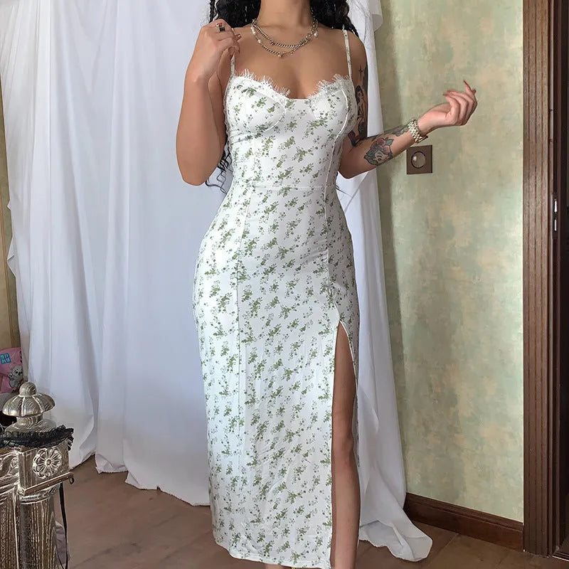 Women's blue lace flower print long dress with a thigh slit and thin suspender straps.
