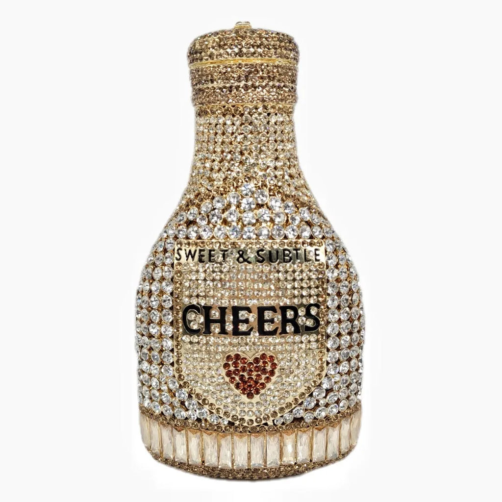 Gold rhinestone champagne bottle shaped hard case evening clutch bag on display