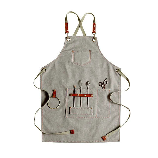 Canvas work apron with cross-back straps in camel colour for cafe and baking use