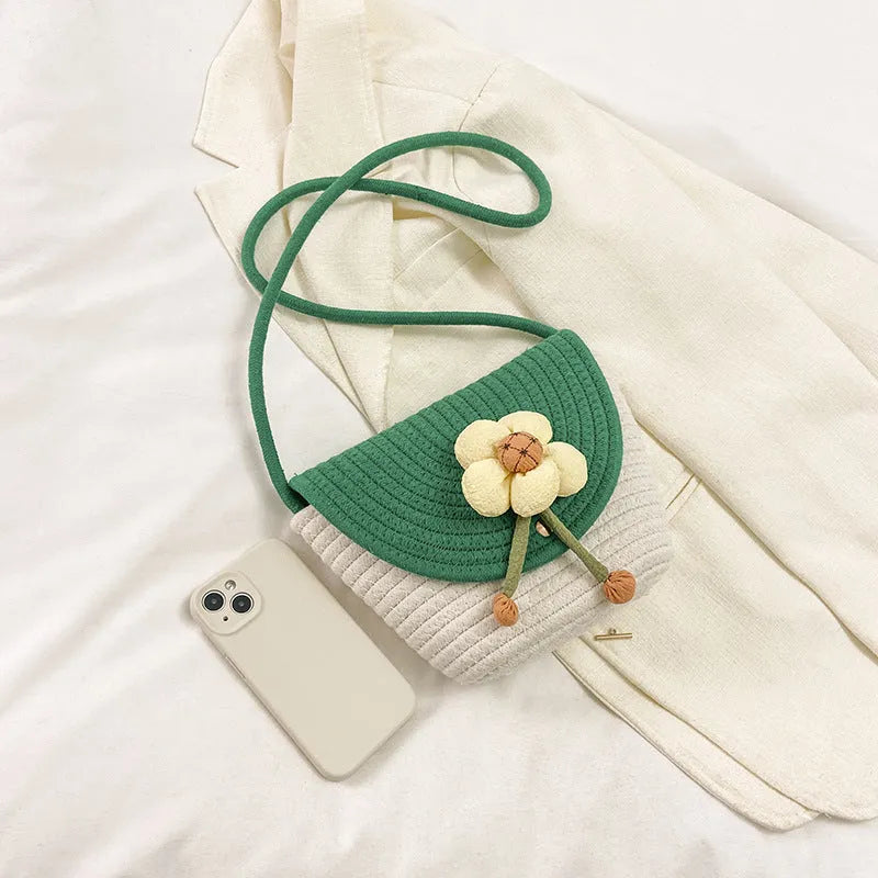 Cotton and linen bucket bag with woven flower details, clamshell shape, available in five colours including sky blue