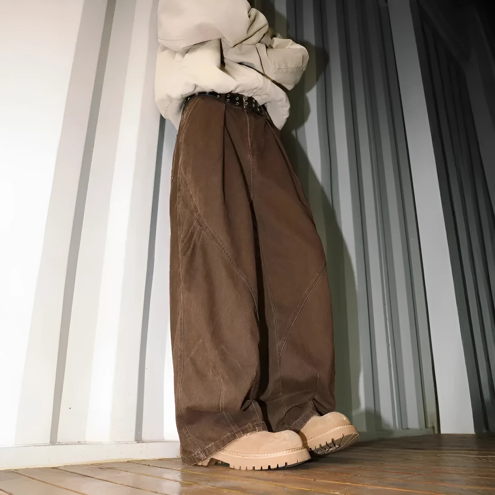 Men's pleated straight-leg loose trousers in apricot colour showing front detail and micro-elastic waistband.