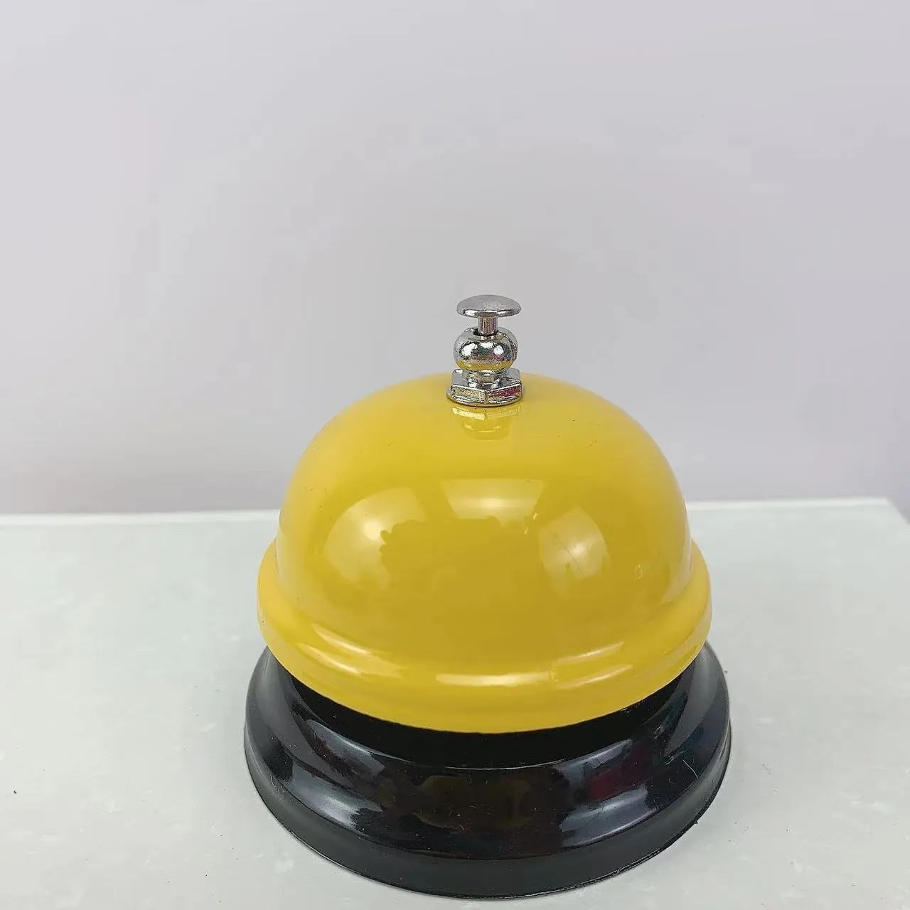 Iron handheld bell in selected colour for classroom games or restaurant service.