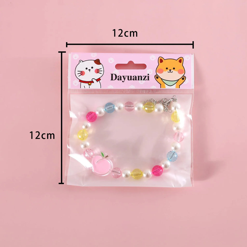 Colourful plastic bead necklace for small pets with peach, rainbow, or small flower pattern options.