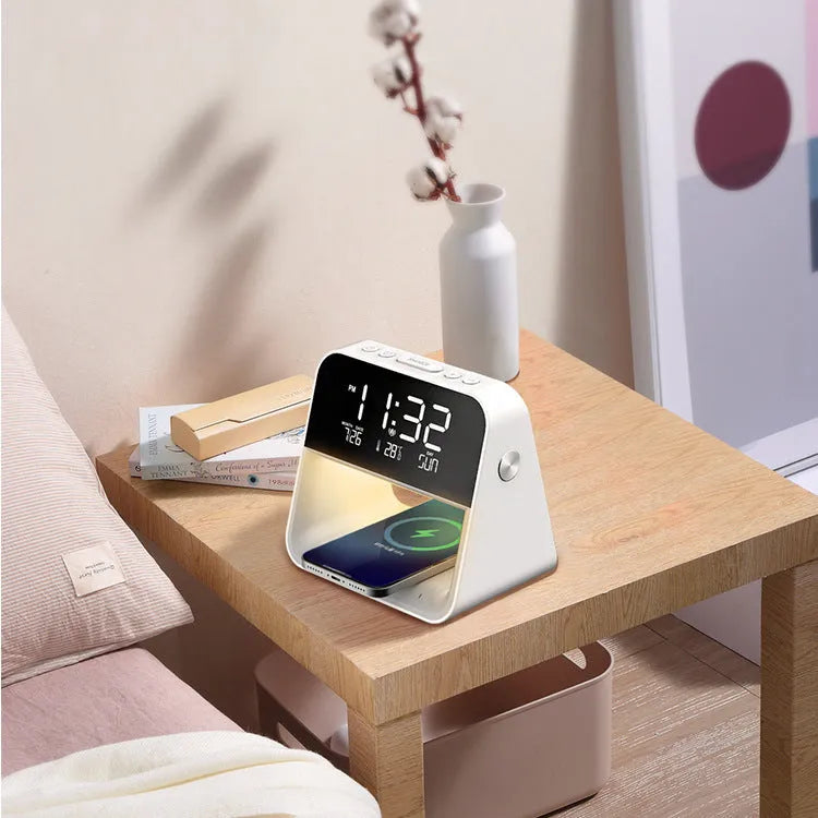 White multifunctional bedside lamp with wireless charger and alarm clock on a nightstand, 15.1x10.6x14.5cm