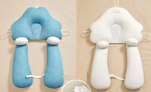 Blue and white U-shaped baby head shaping pillow made of pure cotton on a neutral background.