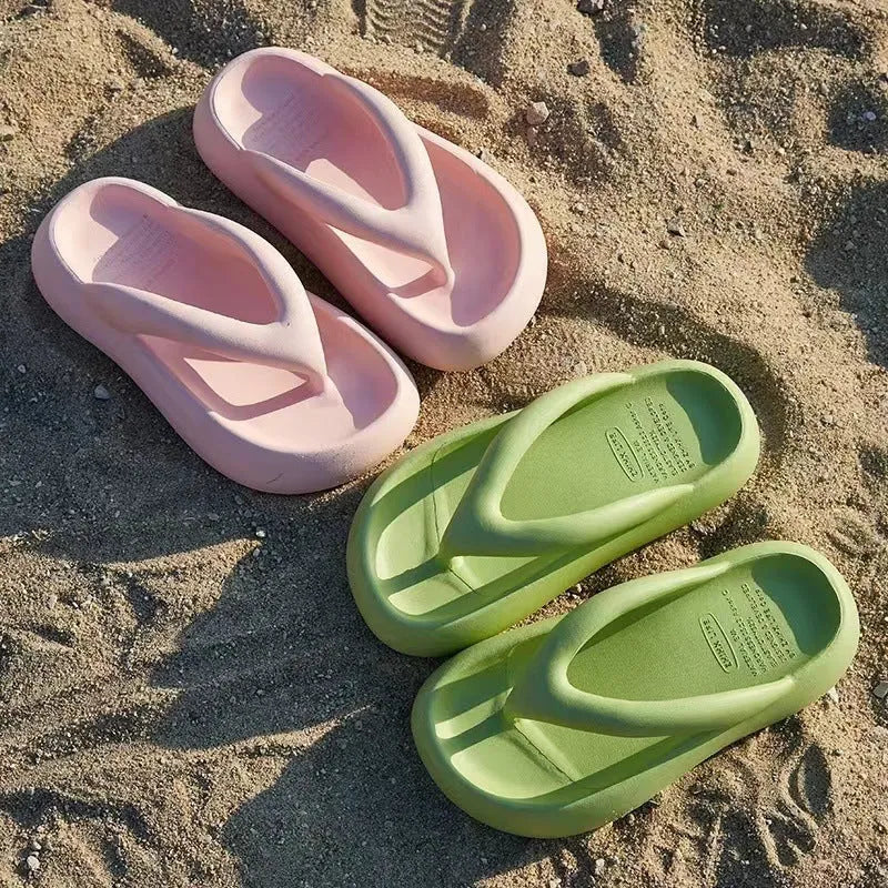 Solid colour thick-soled EVA flip-flops with a bow decoration on the upper.