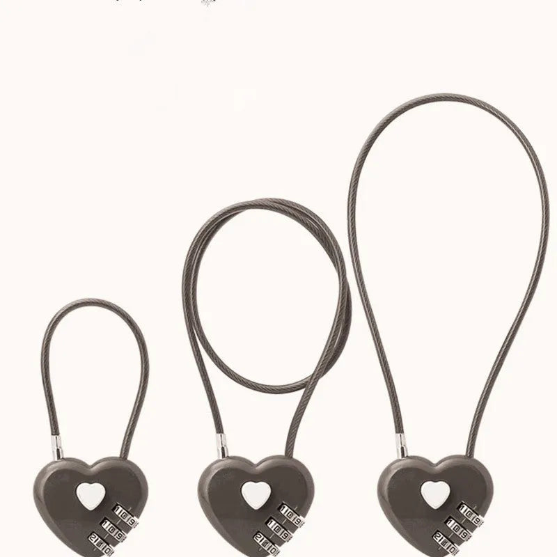Peach heart shaped ABS plastic cable lock with steel rope, shown in multiple colour options for bicycle helmets.