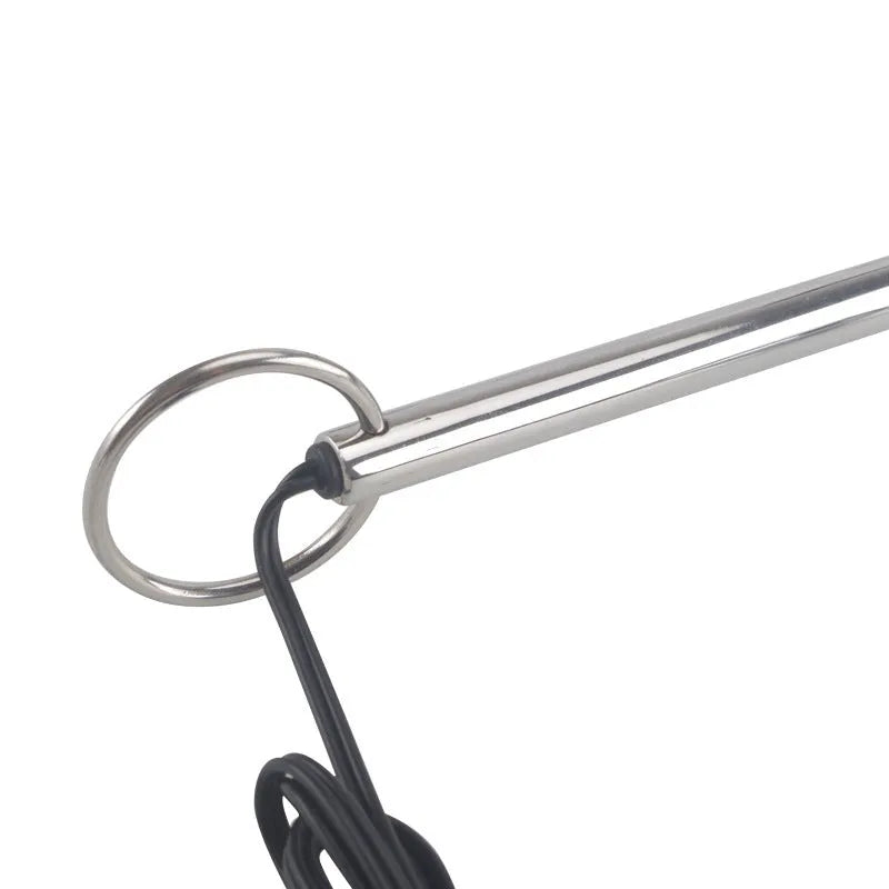 Silver metal stainless steel electric shock couple toy with three round bead sizes on a dark surface