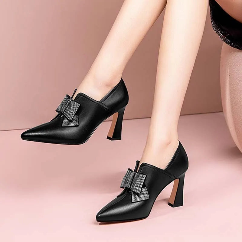 Women's rhinestone bow chunky heel party boots in black PU leather, pointed toe, side view