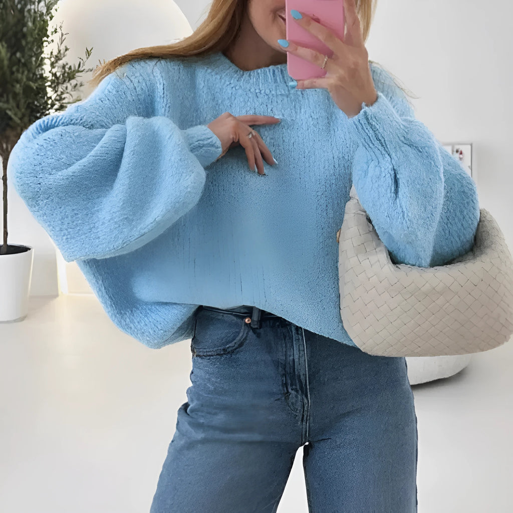 Blue round neck pullover sweater with long sleeves and loose fit, available in sizes S to XL.