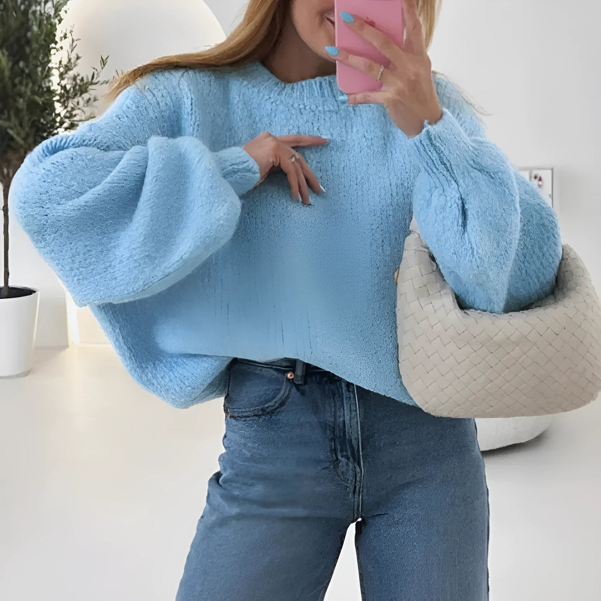Blue round neck pullover sweater with long sleeves and loose fit, available in sizes S to XL.